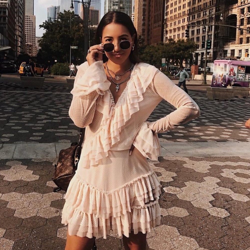 Pink frilly dress. This is NOT sold yet